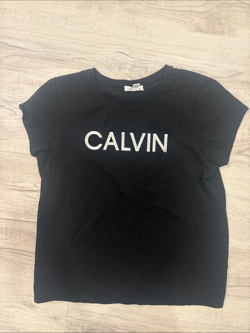 Calvin Klein Black Crewneck Tee with Silver 'CALVIN' Logo - Women